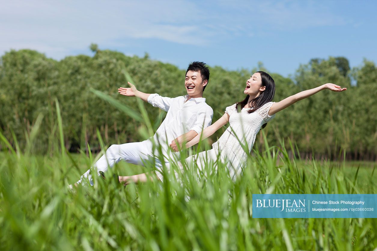 Sweet young Chinese couple outdoors