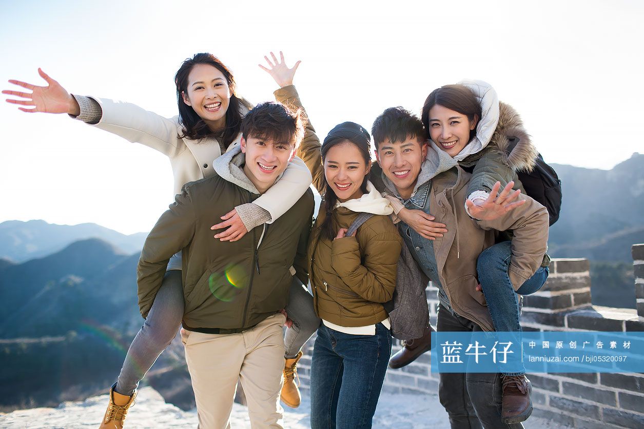 Portrait of happy young Chinese friends on the Great Wall