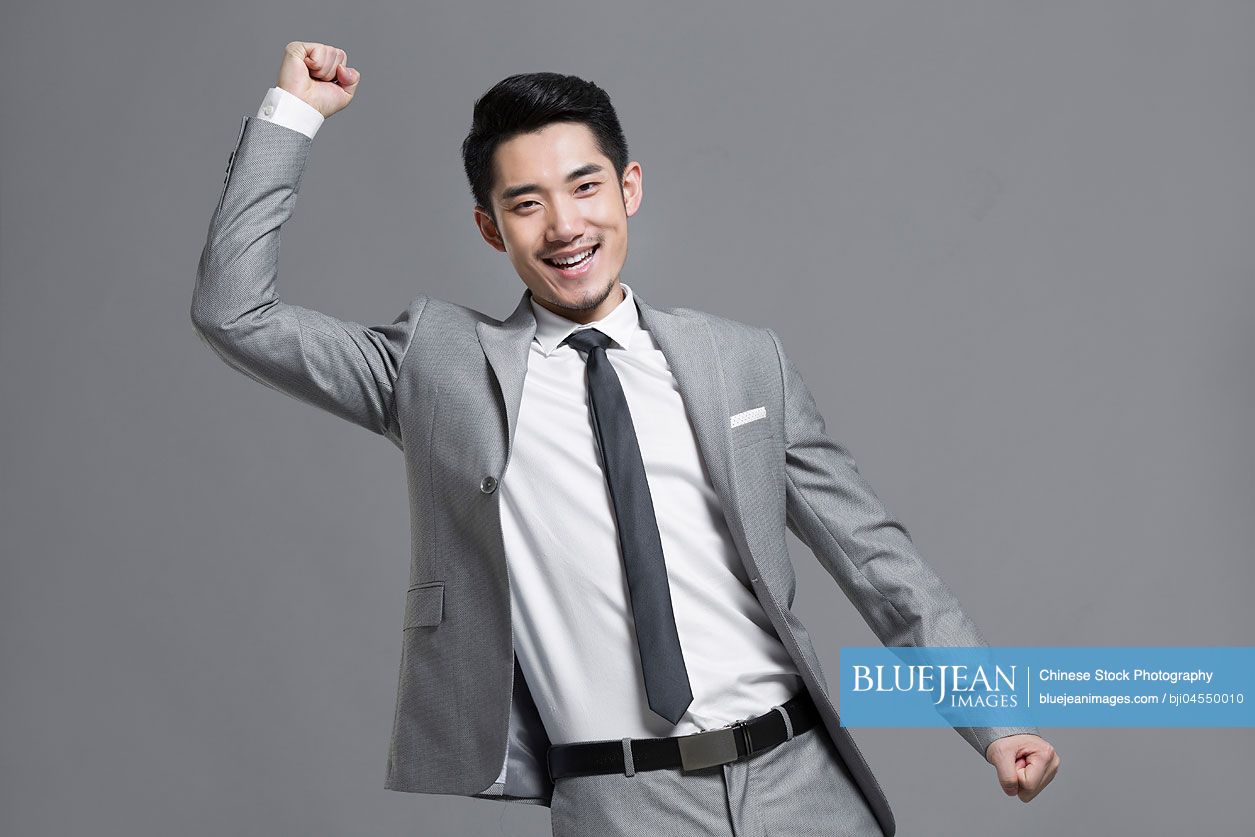 Happy young Chinese businessman