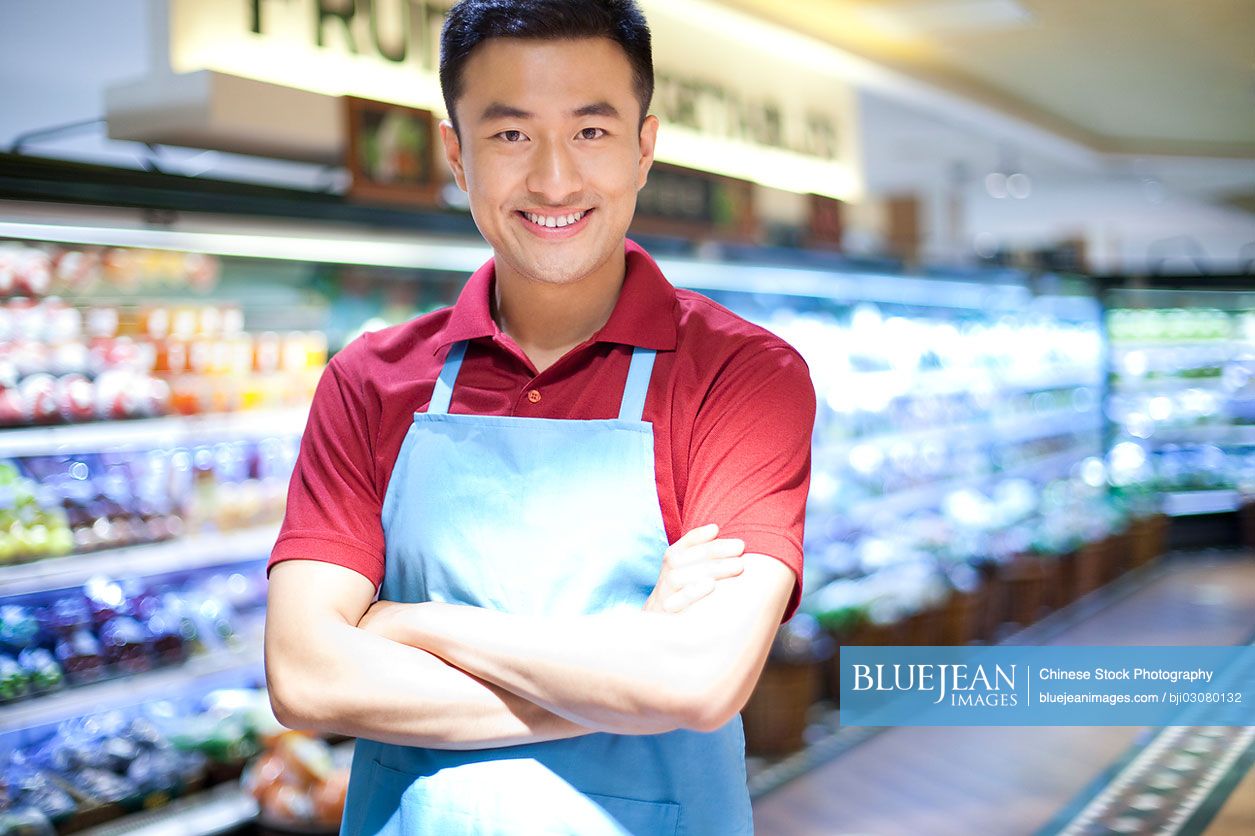 Chinese sales clerk in supermarket