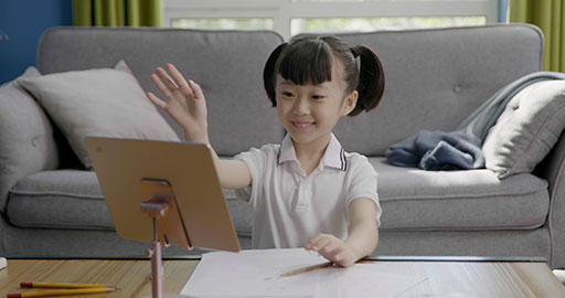 Little girl taking an online class