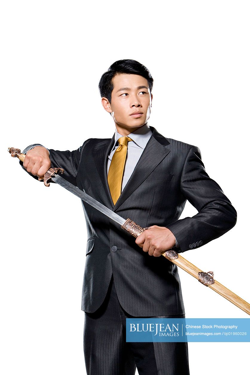 Chinese businessman holding a sword
