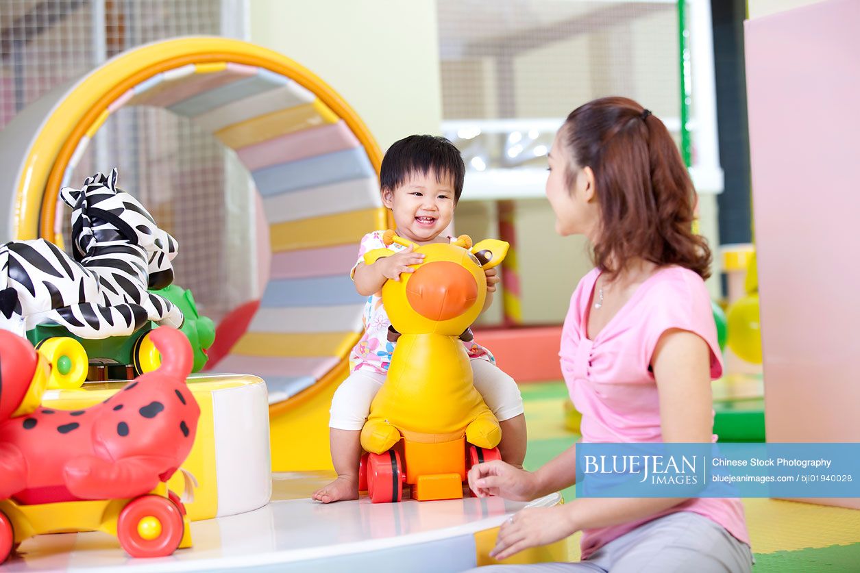 Chinese mother playing with daughter