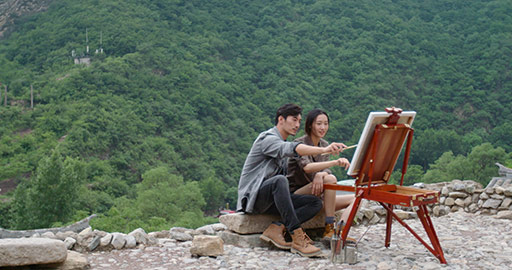 Young Chinese couple painting outdoors,4K