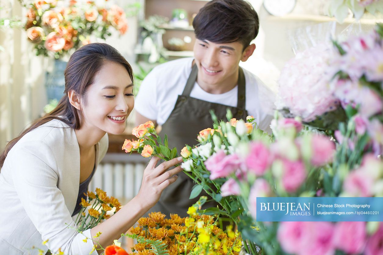 Young Chinese woman buying flowers