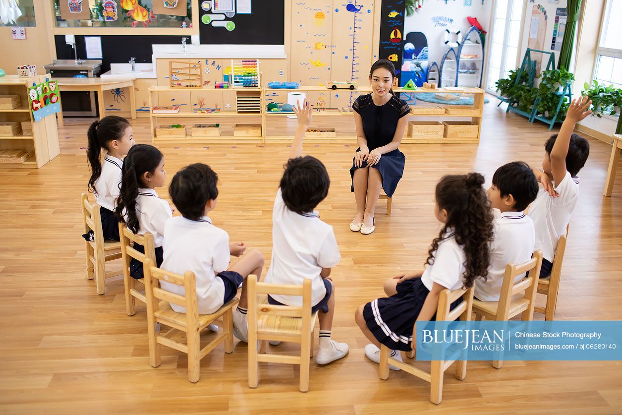 Chinese teacher and children in classroom