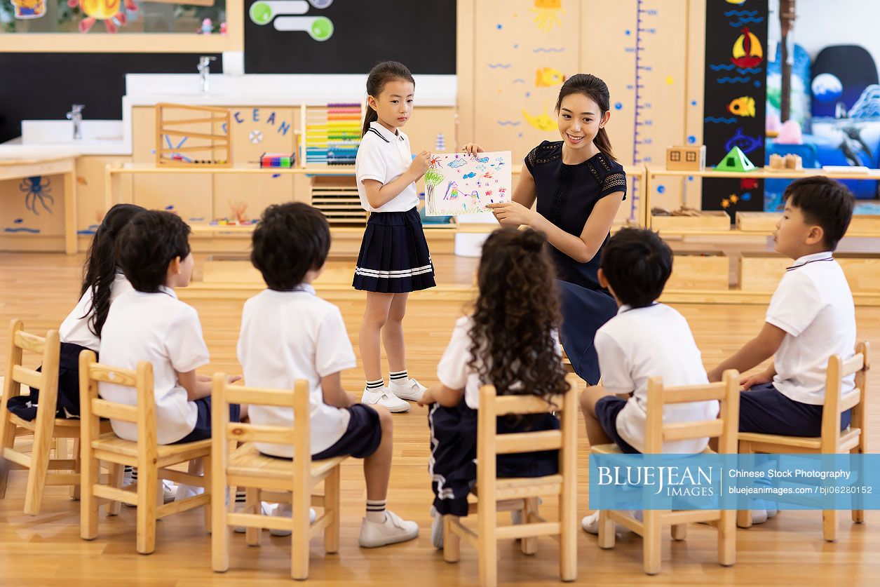 Chinese teacher and children in art class