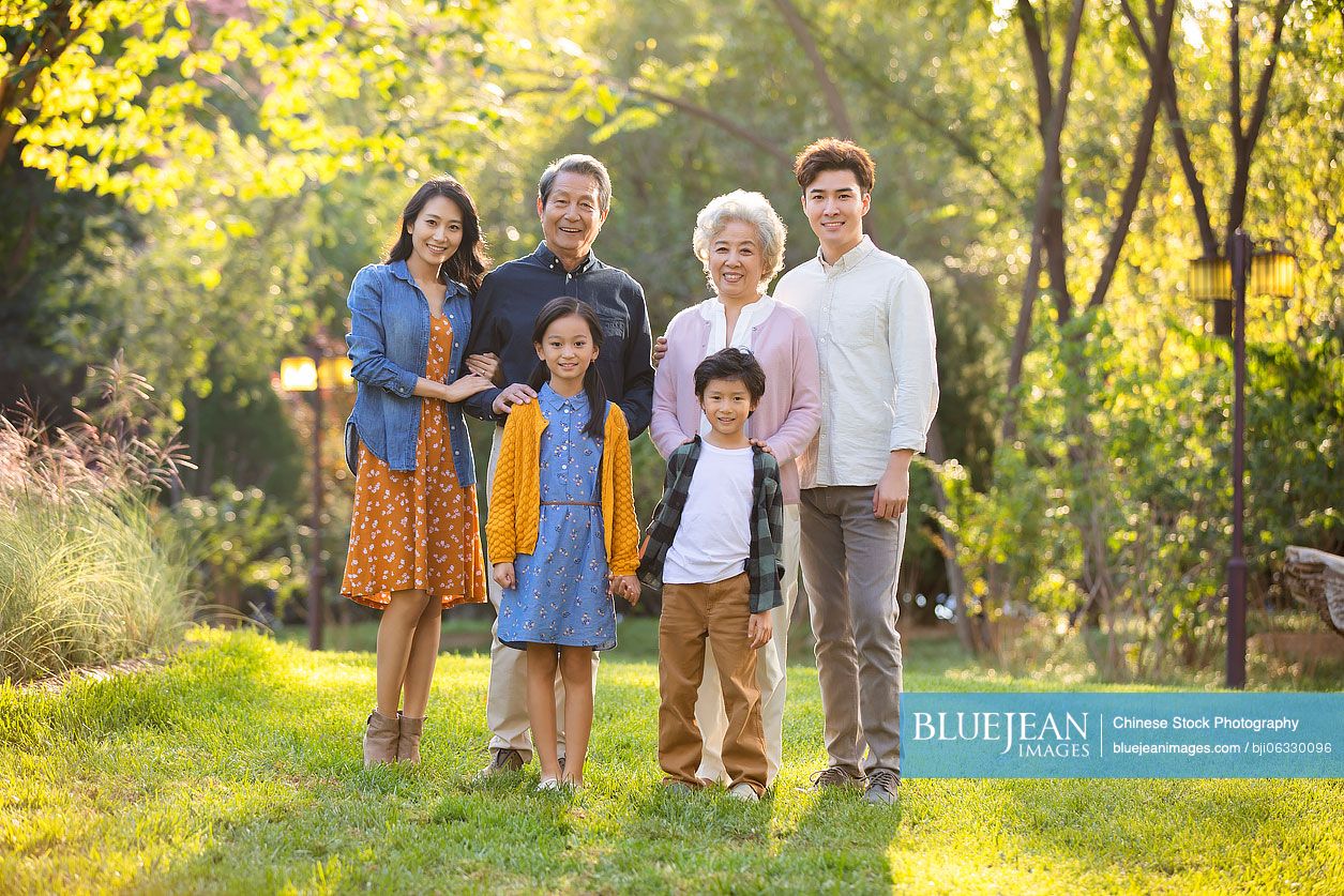 Happy Chinese family having fun in park