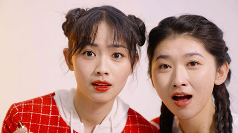 Best female Chinese friends applying make-up