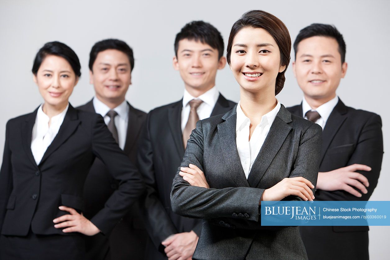 Portrait of professional and confident Chinese business team