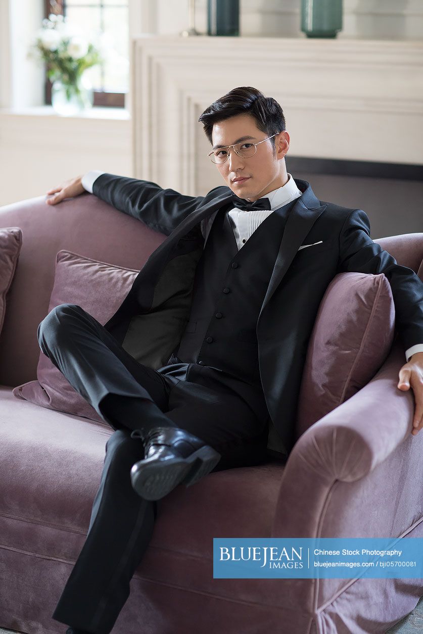 young-chinese-nobleman-thinking-in-the-living-room-high-res-stock-photo