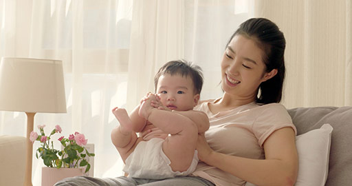 Young Chinese mom holding baby girl,4K