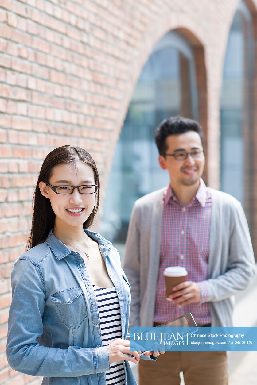 Happy Chinese business partners in cultural industry