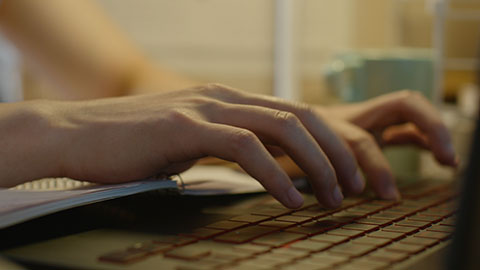 Young Chinese university student using laptop in dormitory,4K