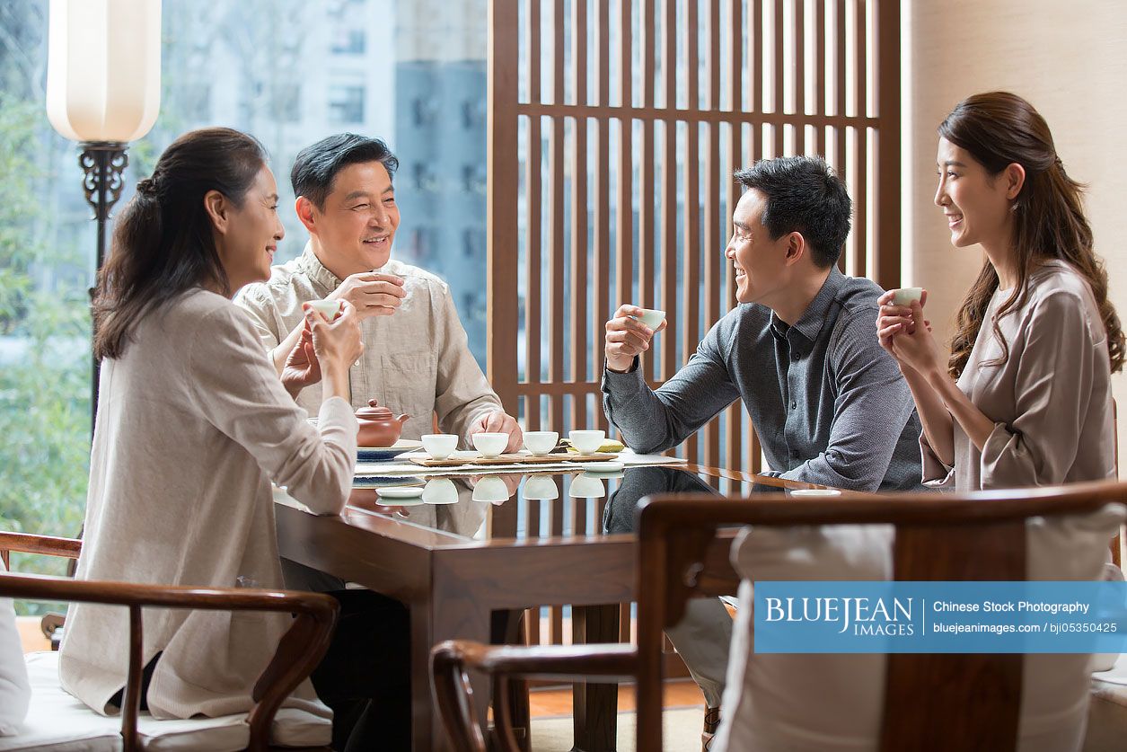 Chinese friends drinking tea together