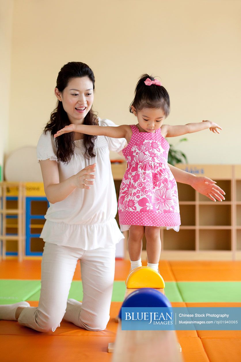 Chinese mother playing with daughter