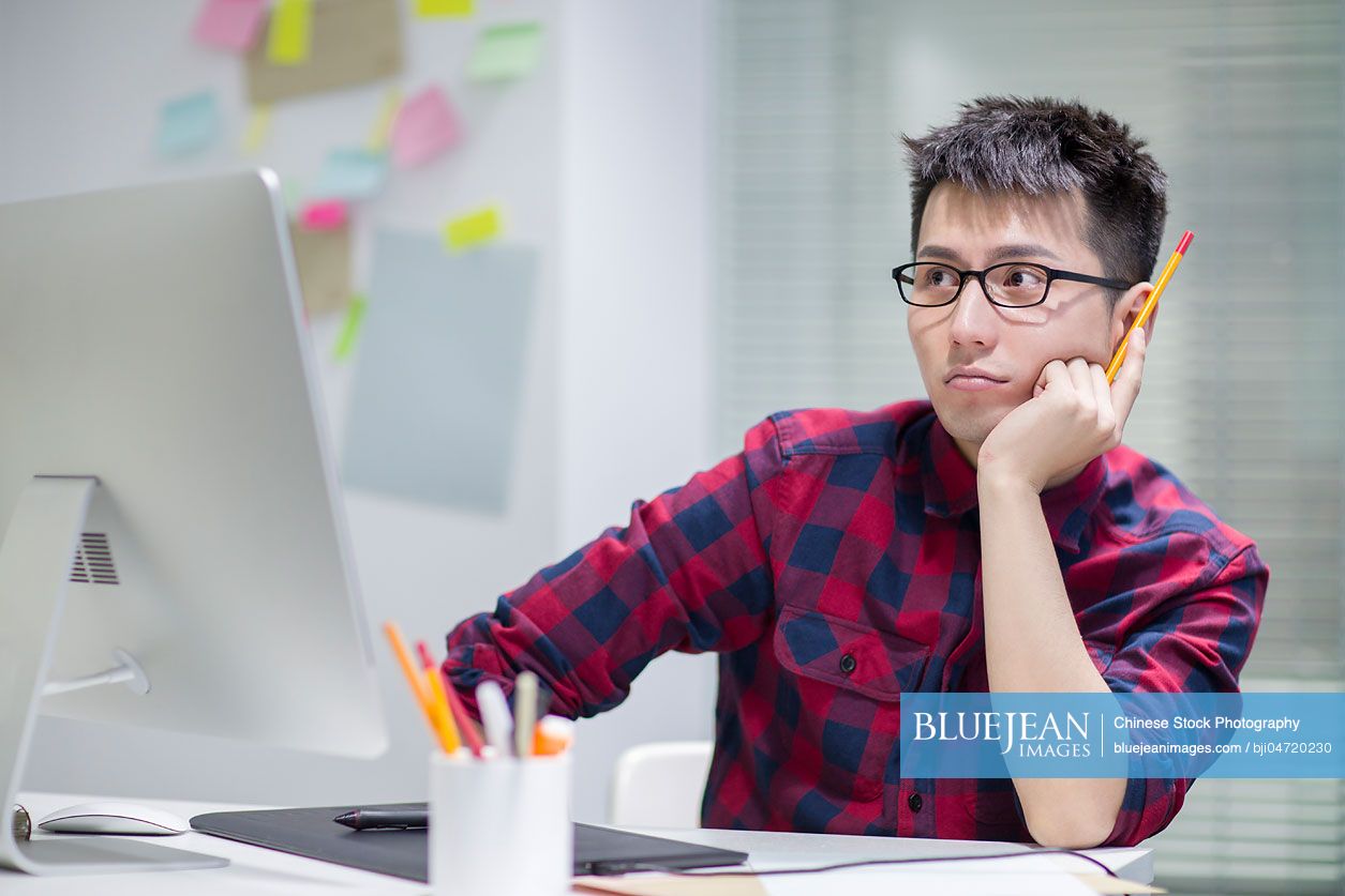 Chinese illustrator working in officeHighres stock photo for download