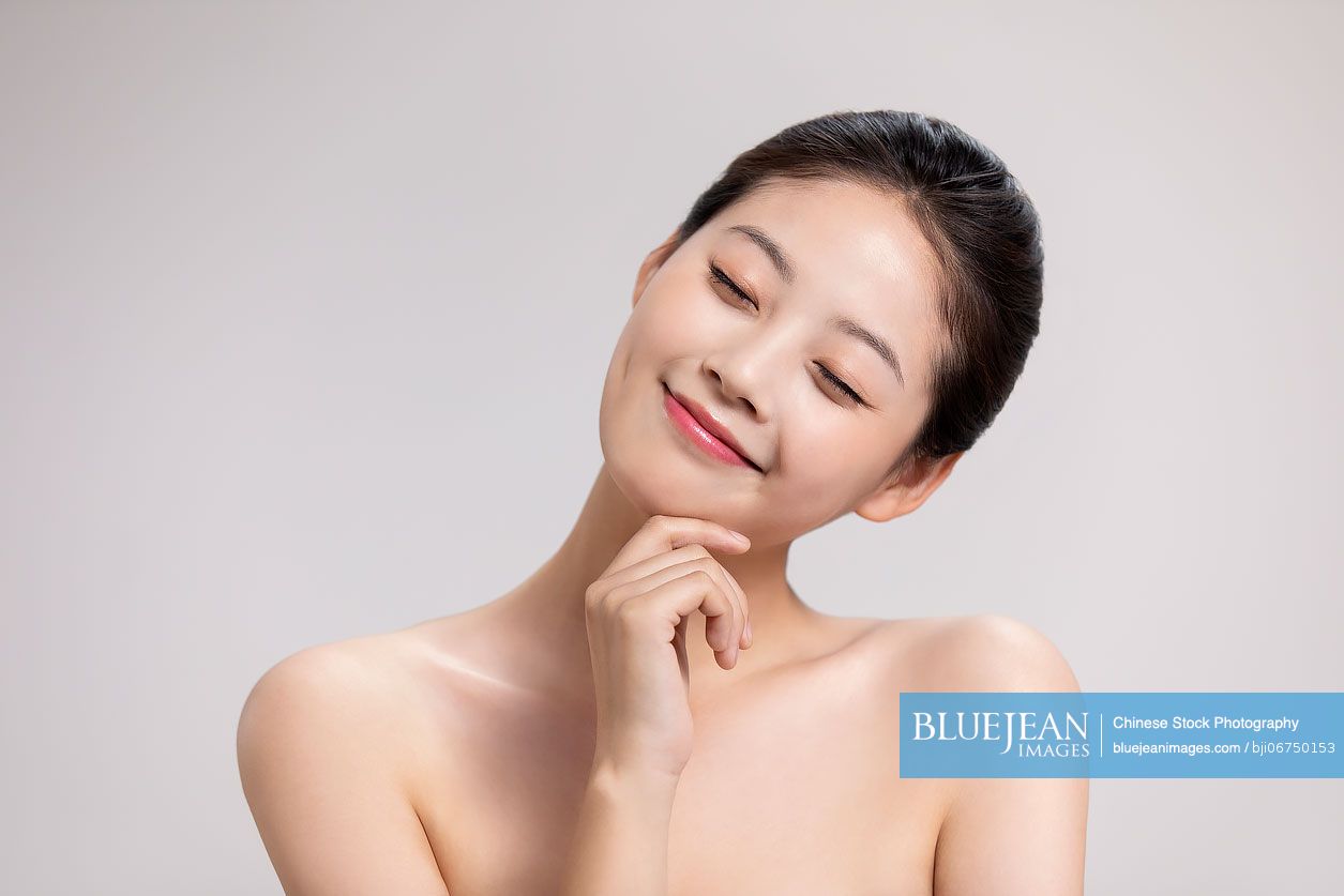 Studio shot of beautiful young Chinese woman