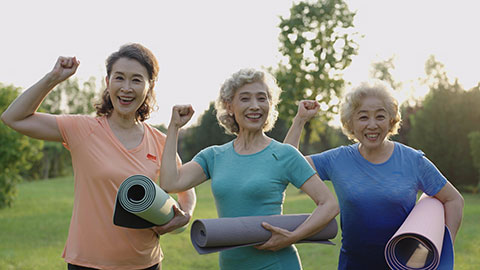 Happy senior Chinese friends exercising in park,4K