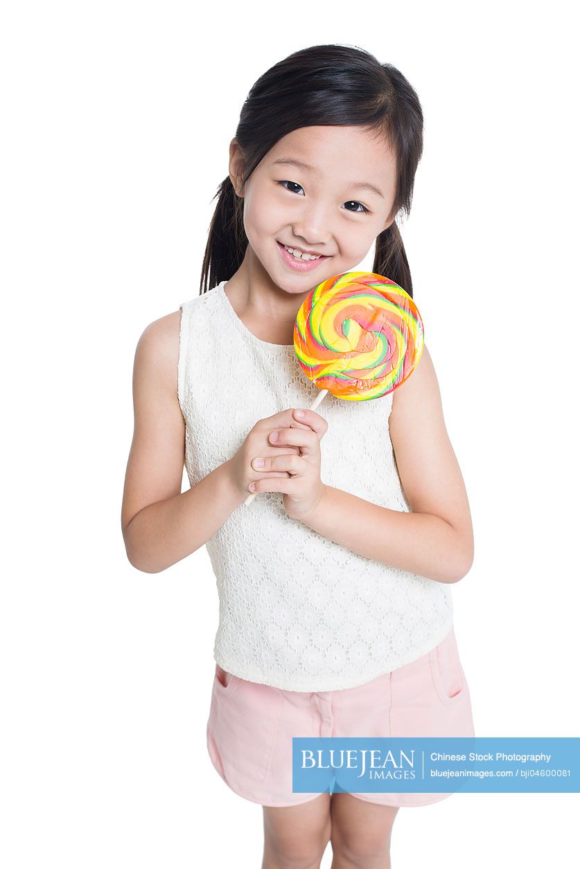 Happy Chinese girl with lollipop