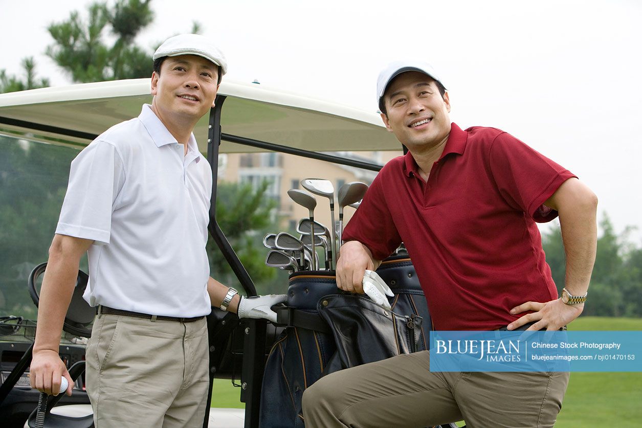 Portrait of two Chinese golfers