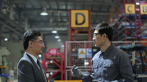 Confident Chinese Manager and engineer talking in factory,HD