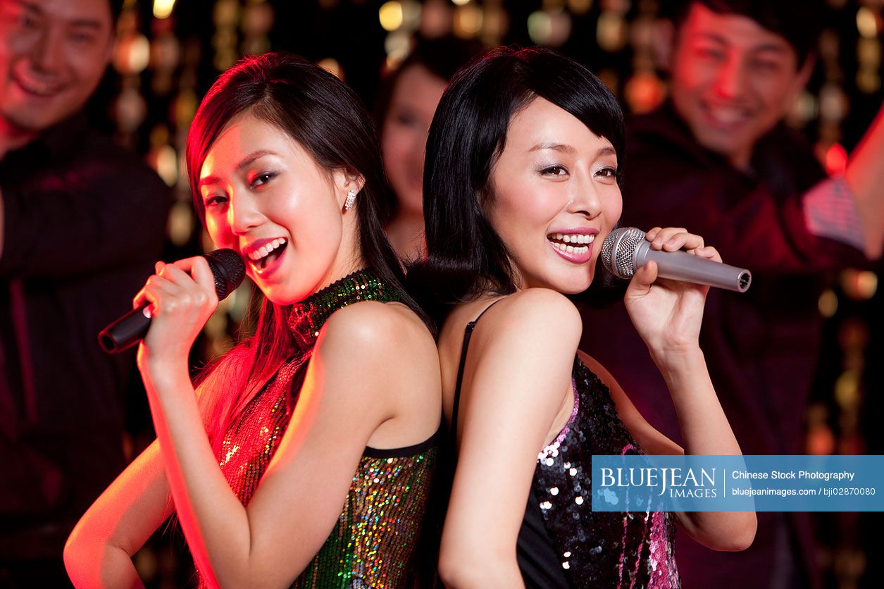 Young Chinese singing karaoke