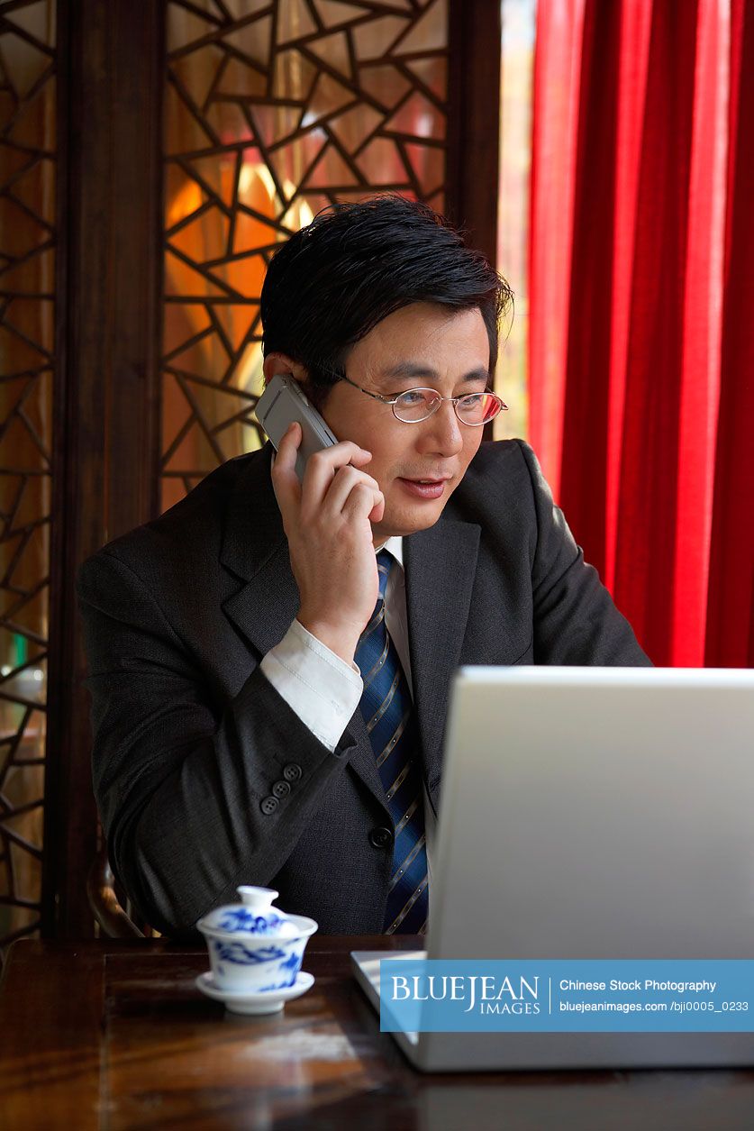Chinese Man Talking On Cell phone