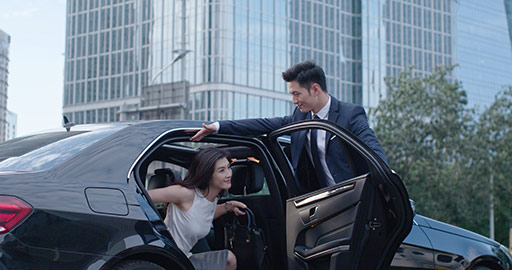 Confident Chinese businesswoman getting out of car,4K