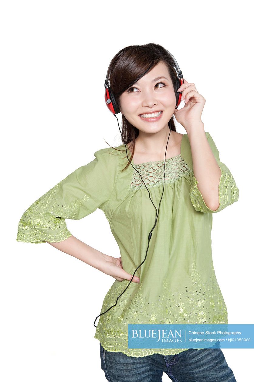 Portrait of young Chinese woman with headphones