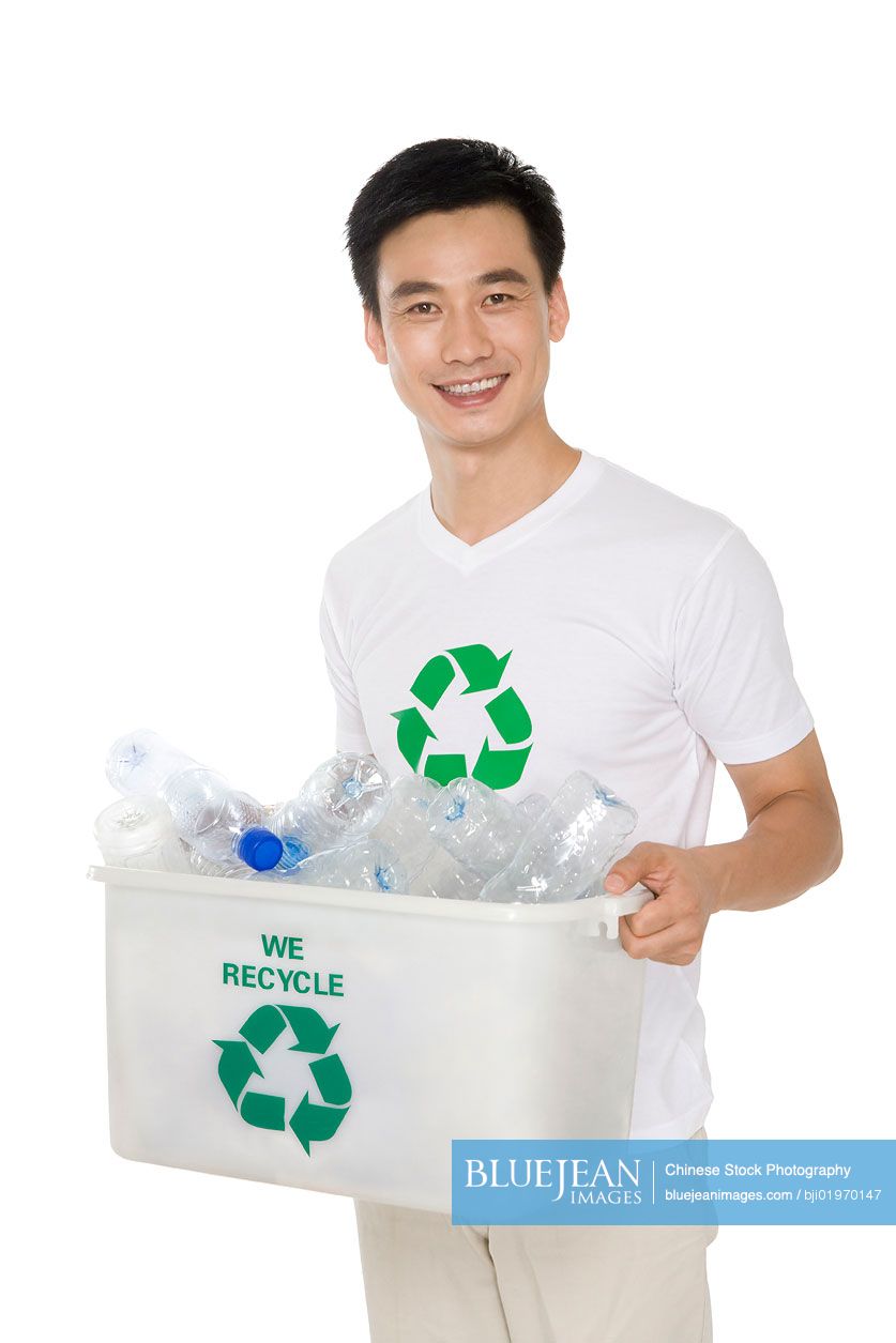 Mid-Adult Chinese man recycling