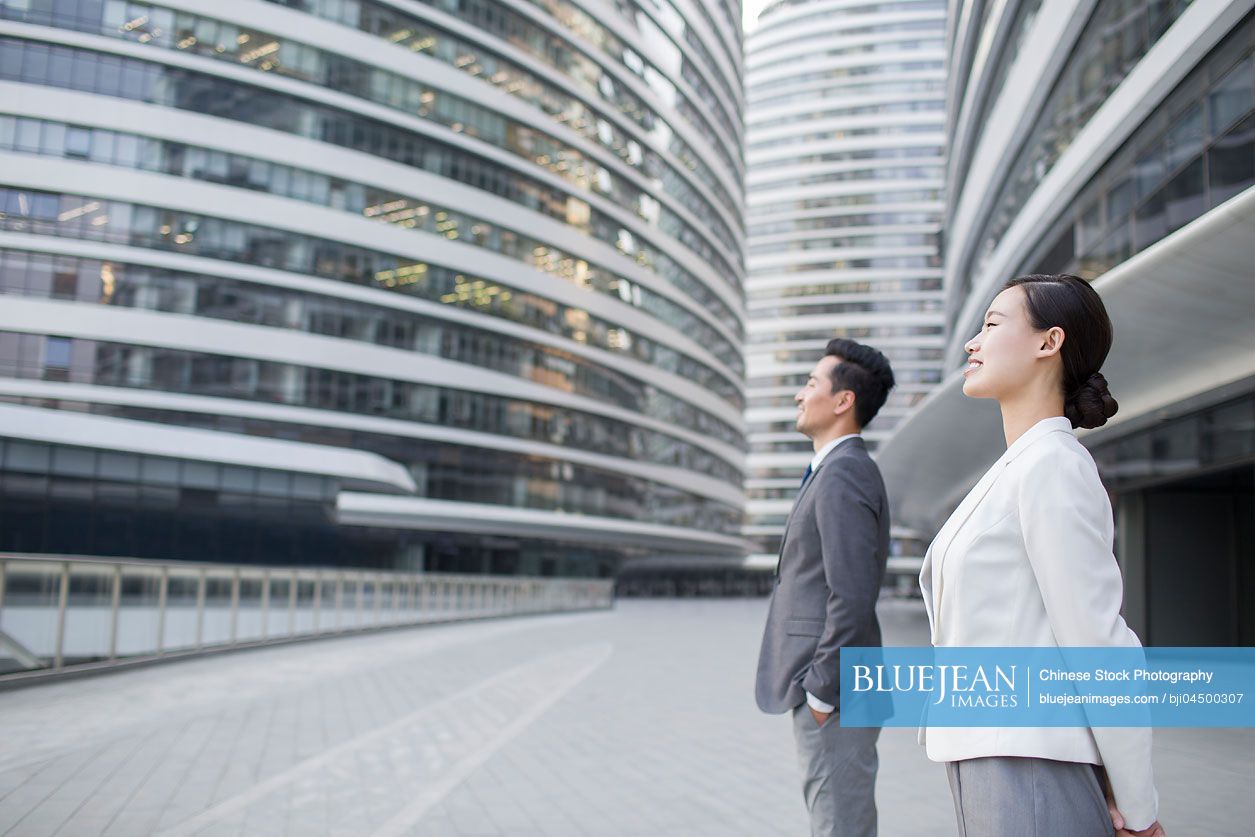 Chinese business person looking at view