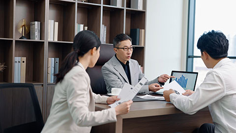 Confident Chinese business people having a meeting