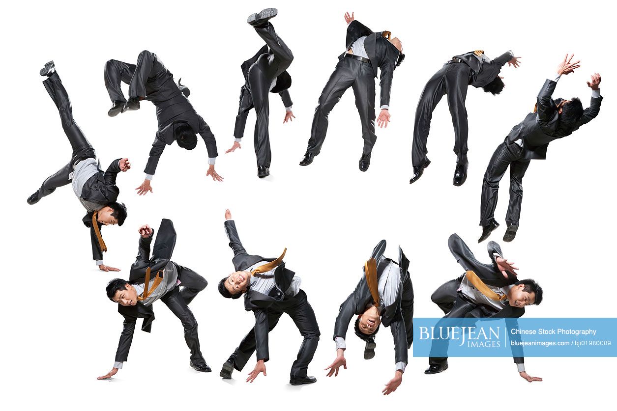 Ten Chinese businessmen flipping in the air