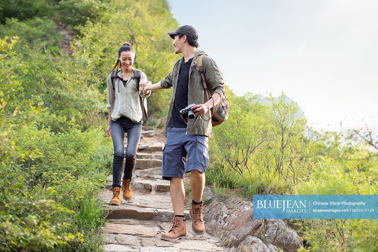 Young couple hiking outdoors