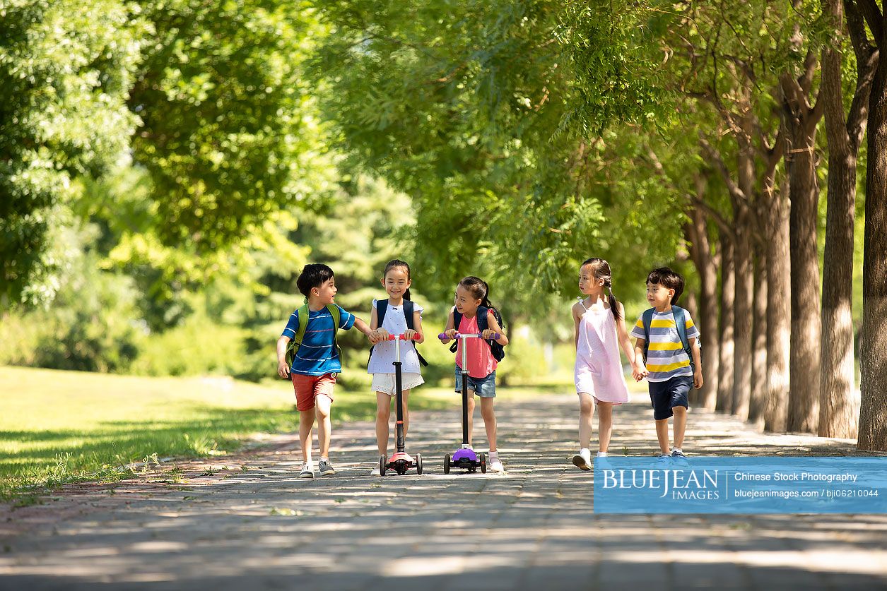 Happy Chinese children going to school
