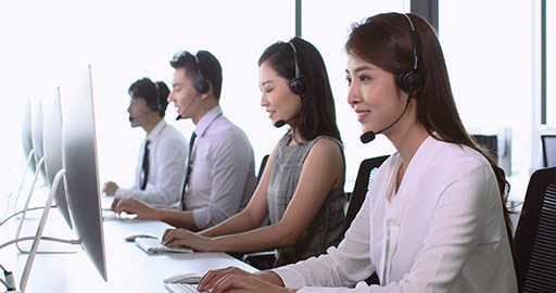 Chinese call center agents working in office,4K