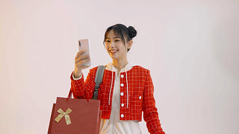 Happy young Chinese woman going home to celebrate Chinese new year