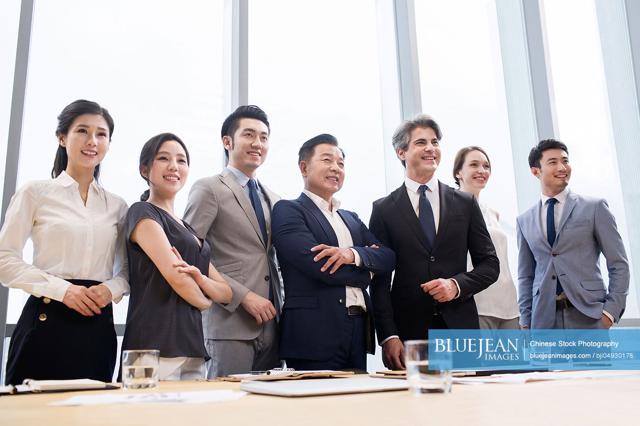 Confident business people in meeting room