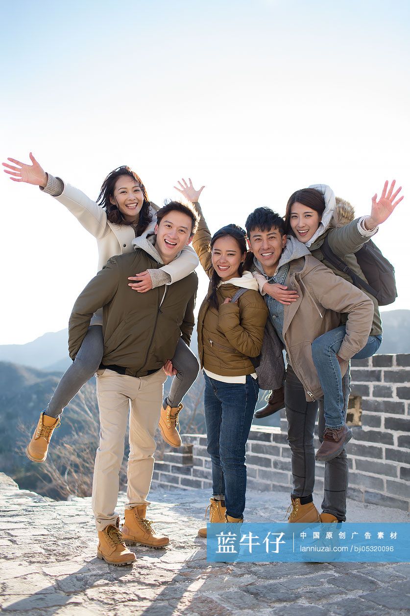 Portrait of happy young Chinese friends on the Great Wall