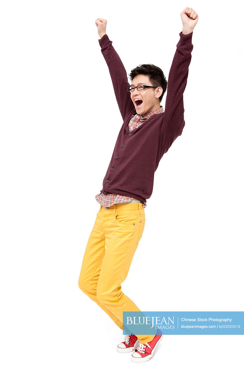 Excited young man cheering for Chinese New Year