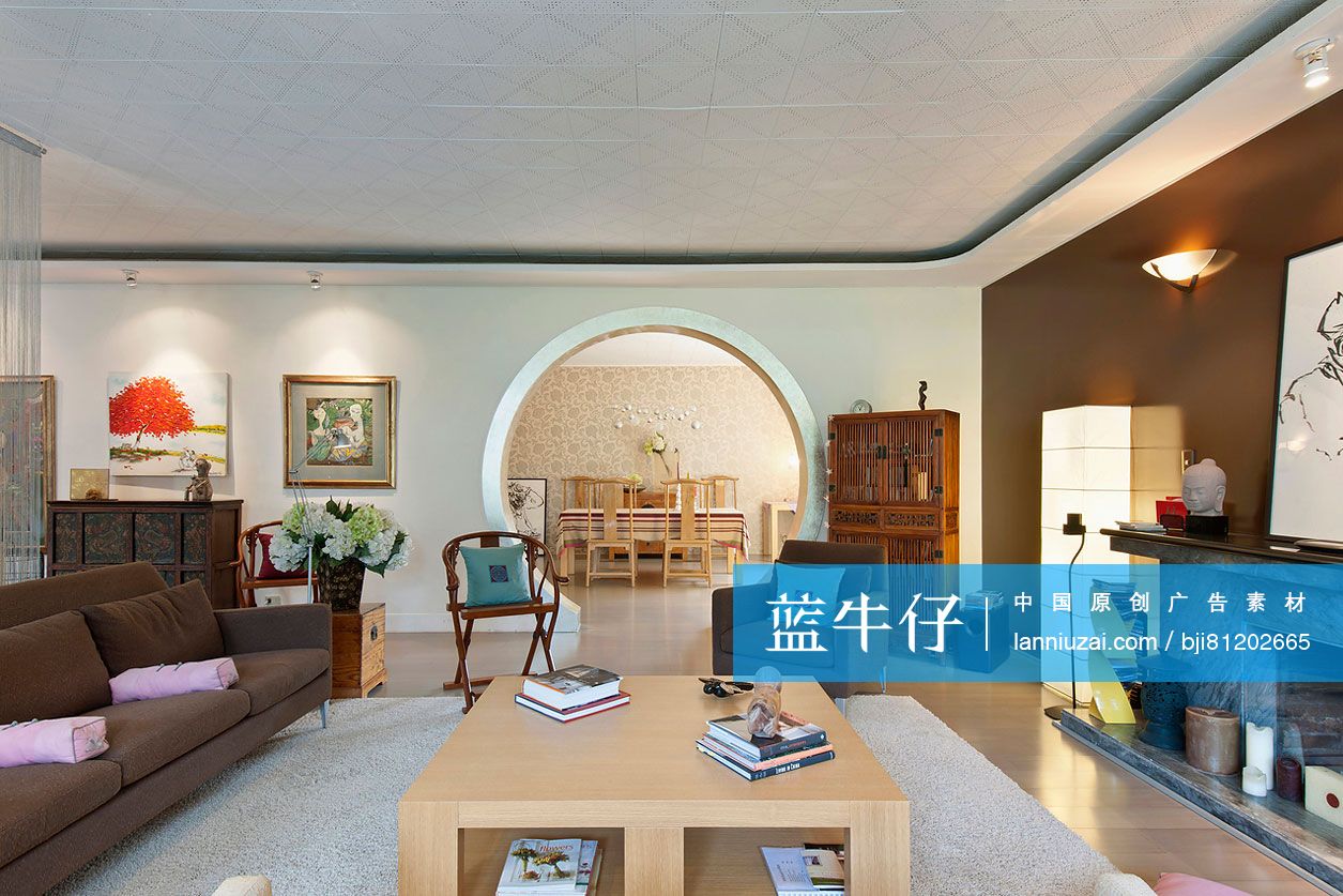 Living room with dining area seen through circular wall in background at contemporary home