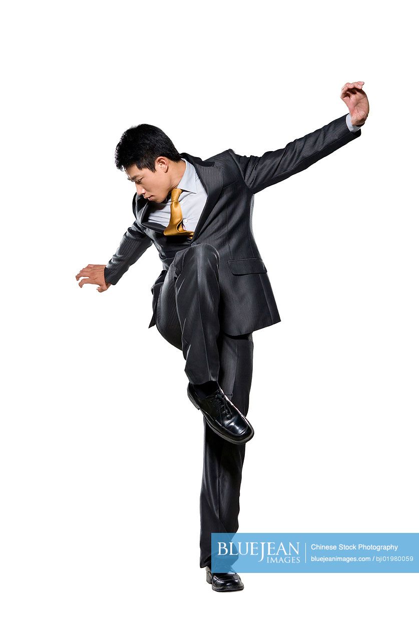 Chinese businessman standing in martial arts stance