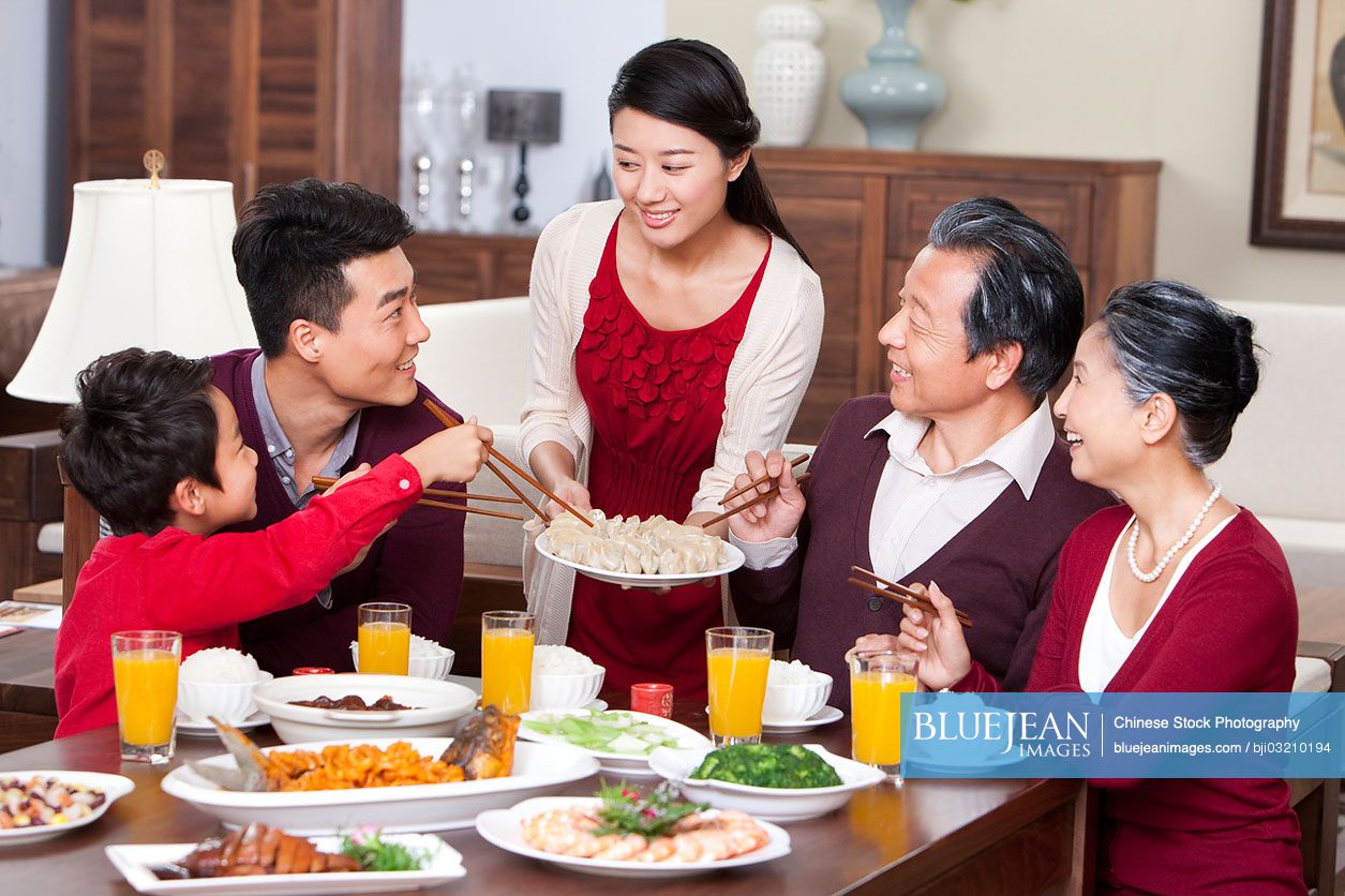 Merry family having Chinese New Year dinner