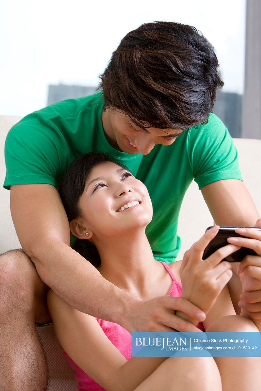 Chinese couple holding each other