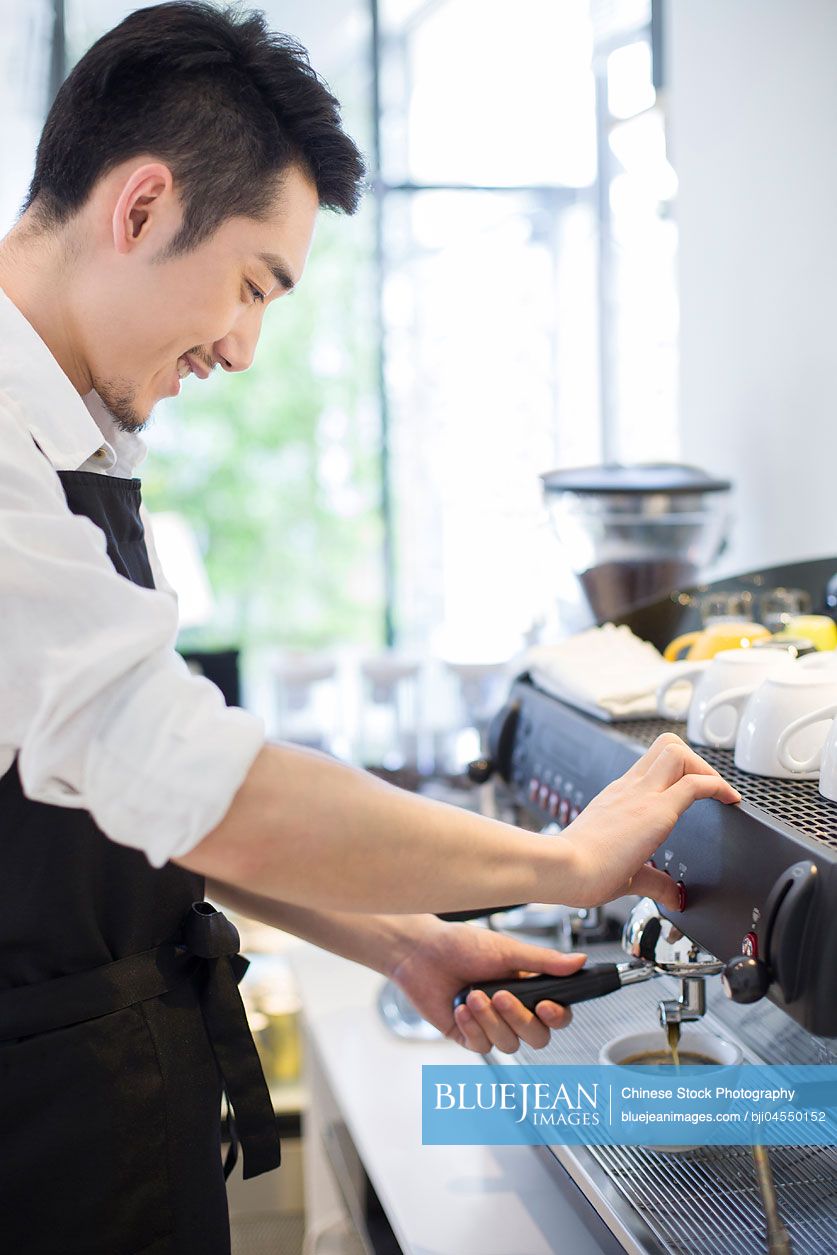 Chinese barista making coffee