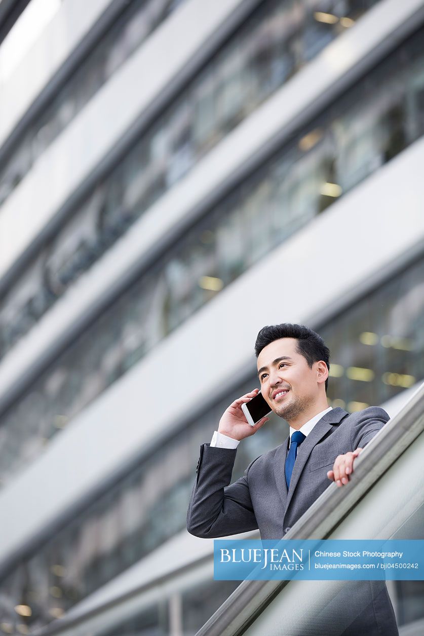 Chinese businessman talking on the phone