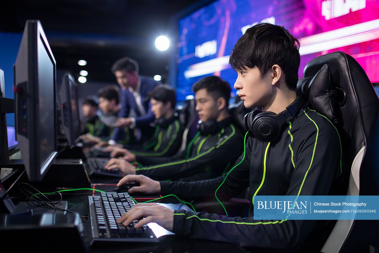 Young Chinese men playing esports