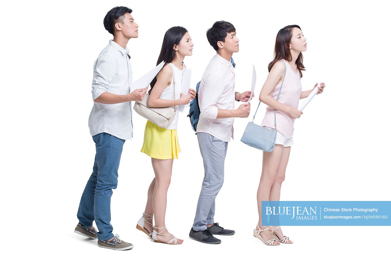 Young Chinese adults waiting in line for job interview
