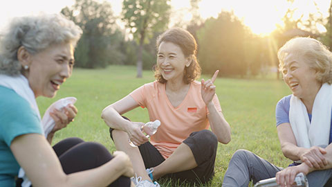 Happy senior Chinese friends relaxing in park,4K